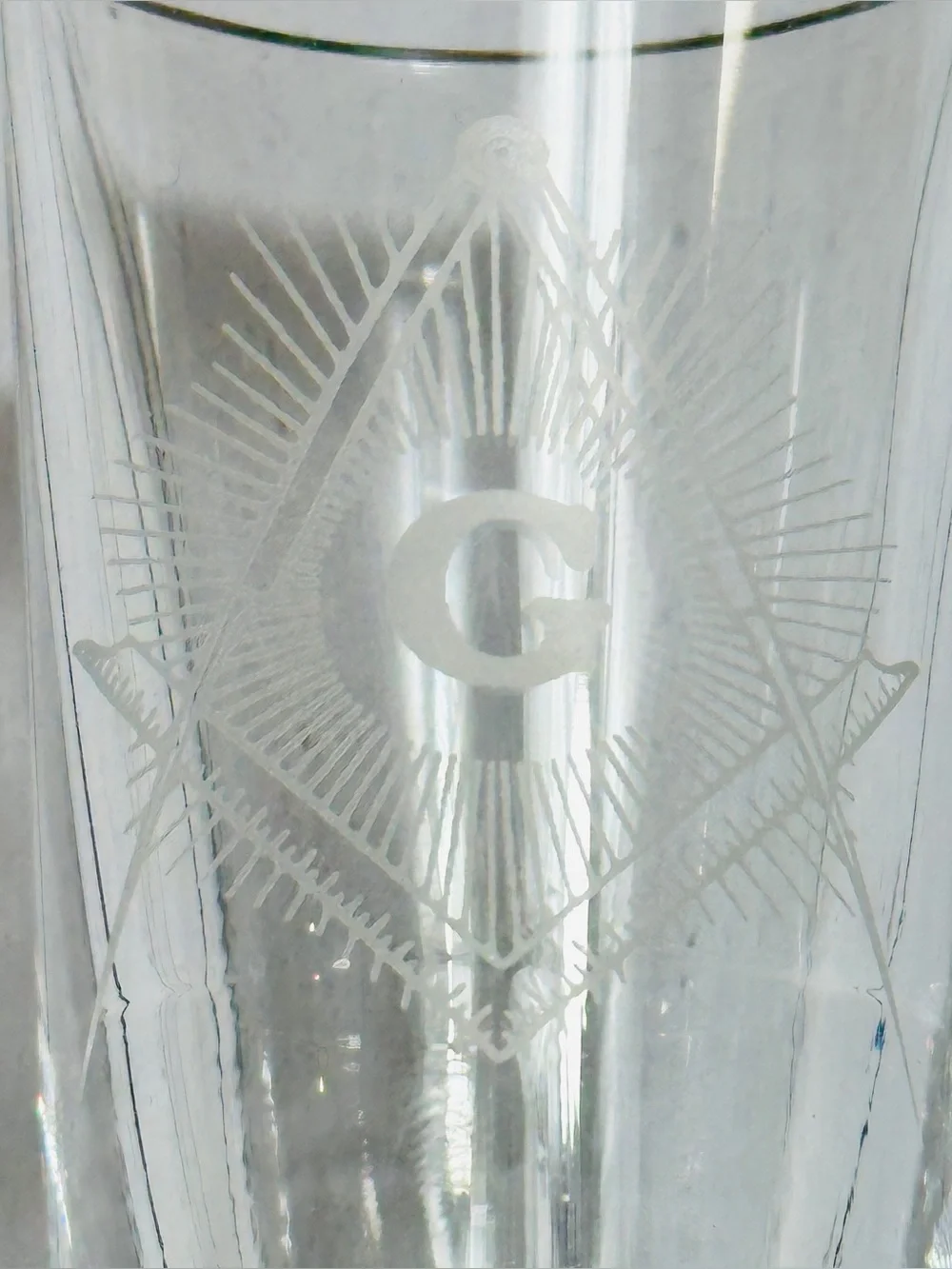 Masonic shot glass featuring laser-etched emblems of Freemasonry